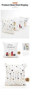Detail of Christmas pillowcase featuring gold foil stars and Merry Christmas typography