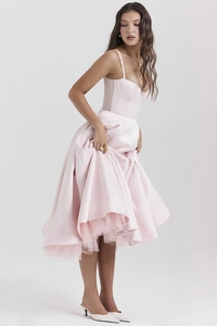 Full view of pink princess dress with mesh layers and satin straps in a studio setting