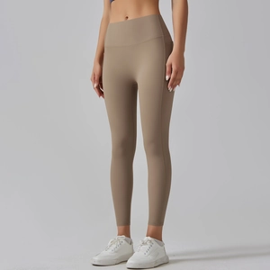 Close-up of high-waisted seamless yoga pants in khaki with moisture-wicking fabric