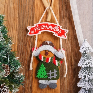 Detail of Christmas reindeer ornament with Feliz Navidad banner on wooden wall background