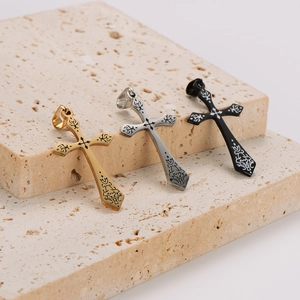 Retro cross pendants in gold, silver, and black finishes with ornate engraved patterns