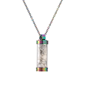 Detail of rainbow stainless steel perfume bottle pendant with white natural stone chips