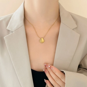 Elegant gold shell pendant necklace for women on minimalist snake chain with chic style