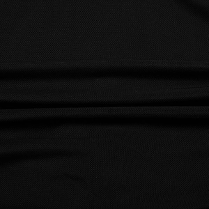 Detailed close-up of black woven fabric texture with folds on sexy V-neck bodycon dress