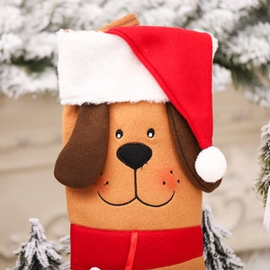 Creative Christmas puppy stocking decoration in khaki brown with festive red hat and ribbon
