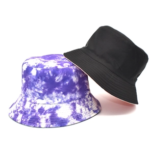 Detail view of tie-dye bucket hat stitching and texture in black and purple patterns
