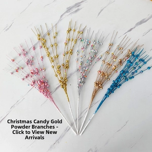 Close-up of glittery Christmas berry stems in six metallic colors on marble surface