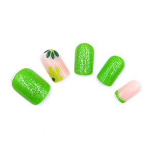 Sparkly green french reusable press-on nails with glitter and daisy flower designs