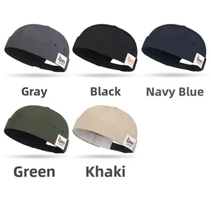 Flat lay of quick-dry docker caps in grey, black, navy, green and khaki colors