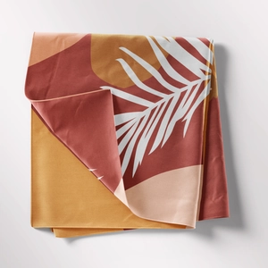 Detail showing high-quality bohemian geometric fabric texture and neat stitched edges