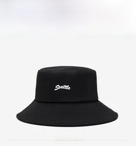 Front view of black canvas bucket hat with white Seattle script embroidery detail