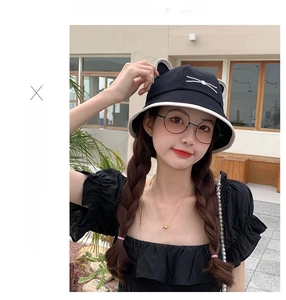 Close-up of cute cat ear design and white whisker embroidery on black sun bucket hat
