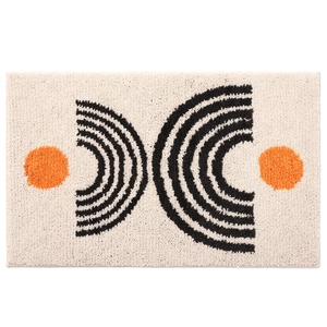 Plush minimalist bathroom mat with absorbent tufted surface and geometric circle patterns