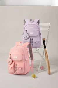 Pastel canvas backpacks in purple and pink with multi-pockets and a smiley charm