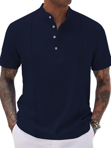 Detail of navy blue men's polo shirt featuring four buttons and vertical stitching