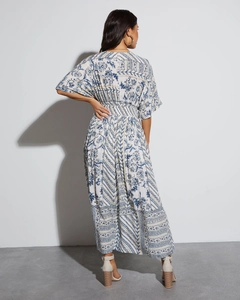 Detail view of the V-neck back design and bohemian blue floral print maxi dress