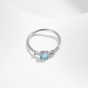 Elegant S925 sterling silver ring with blue round gemstone and side diamond accents