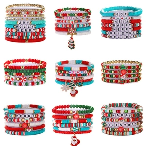 Detail view of 8-piece Bohemian Christmas stretch bracelets with JOY and MERRY letter beads