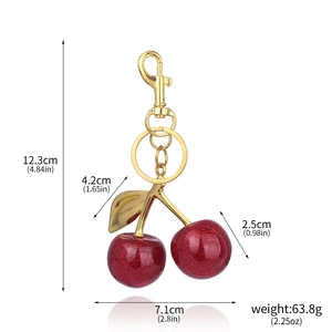 Detailed size chart for the glittery cherry keychain with dimensions and net weight specs