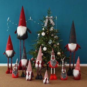 Telescopic Christmas gnome plush figures with red and grey hats near a Christmas tree