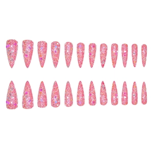 Macro shot of 24pcs long stiletto press-on nails with bright pink glitter and sequins
