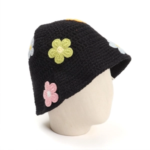 Handmade crochet bucket hat for women with colorful floral patterns and knit texture