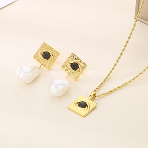 Detailed set of gold vintage necklaces and earrings with square evil eye and baroque pearls