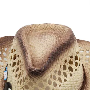 Detail of woven straw cowboy hat showing gradient texture and breathable hollow design