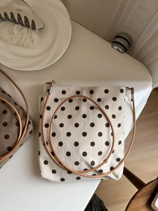 Vintage polka dot corduroy crossbody bag in cream with adjustable brown strap