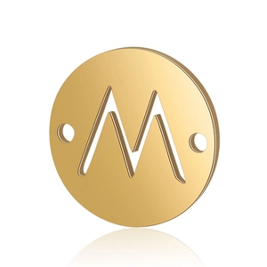 Close-up of golden stainless steel round letter M pendant with double hole design