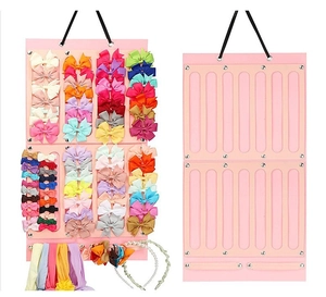 Pink felt wall organizer showing storage capacity for children's hair accessories