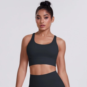 Detail of black sports bra with wide straps and moisture-wicking fabric for gym training