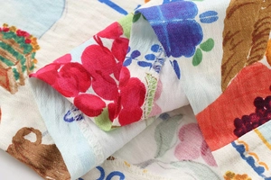 Macro shot of floral digital print fabric showing high-quality stitching and texture