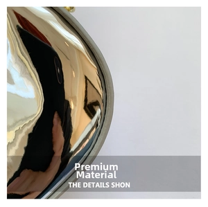 Macro detail of glossy metallic mirror patent leather finish on women fashion handbag