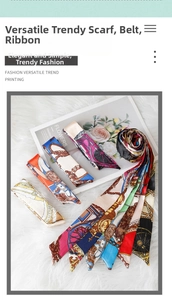 Detailed view of assorted silk twilly scarves with vintage patterns on a white faux fur rug