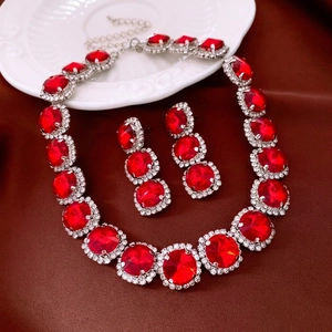 Vintage jewelry set with oval ruby pendant necklace and matching drop earrings