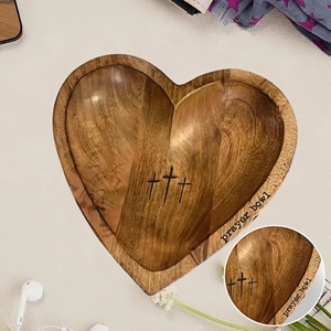 Handcrafted heart-shaped wooden prayer bowl featuring three engraved crosses on the interior
