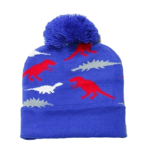 Detail of blue knitted dinosaur beanie featuring a soft texture and fluffy pompom