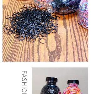 Elastic disposable rubber bands in mixed macaron colors and classic black inside a bottle
