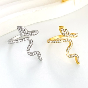 Minimalist silver and gold snake rings set with cubic zirconia pave stones