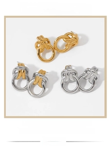 Three pairs of elegant knotted metal stud earrings in gold and silver polished finishes