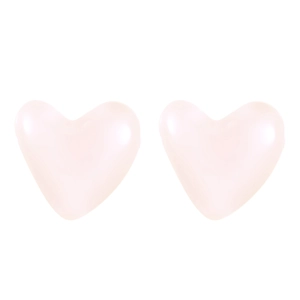 Close-up of heart-shaped nipple covers in soft pink skin-friendly silicone material
