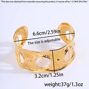 Detail showing dimensions of gold hollow cuff bracelet with ripple texture and open band