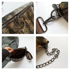 Detail view of brown printed chest bag with skull pattern, metal chain, and interior pocket