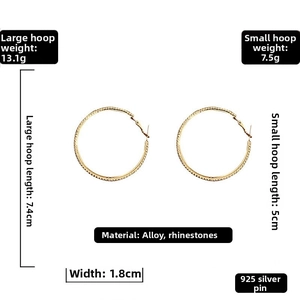Detail of silver needle hoop earrings with rhinestones in 5cm and 7.4cm sizes