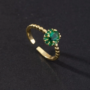 Vintage gold serpent ring with emerald green zircon stone and adjustable bubble band