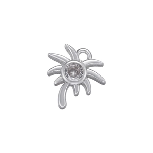 Detail showing a silver coconut tree pendant with a sparkling inset zircon gemstone