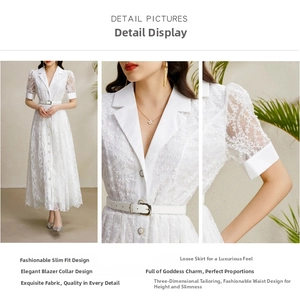 Détails de la robe longue en dentelle blanche avec col tailleur et motifs floraux