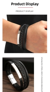 Detail of men's layered black leather bracelet with stainless steel magnetic clasp