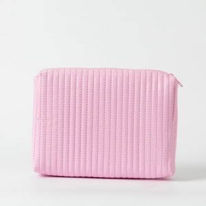 Detail of pink quilted synthetic leather makeup bag with matching zipper closure